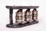 Handcrafted tibetan prayer wheels with wooden frame. - Image 2