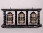 Handcrafted tibetan prayer wheels with wooden frame.