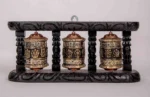 Handcrafted Tibetan copper and brass prayer wheels with wooden frame.