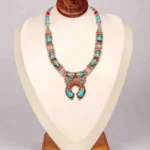 Handcrafted Turquoise Teardrop Necklace with Coral Accents.