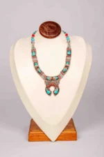 Handcrafted Turquoise Teardrop Necklace with Coral Accents.